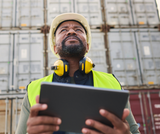 logistics tablet and black man doing container